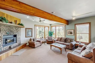 a living room with a fireplace and couches at Lookout Lodge in Zephyr Cove