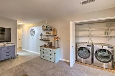 a laundry room with a washer and dryer at Forest-View Deck and Fire Pits Pine Grove Retreat! in Jackson