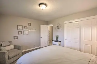 a bedroom with a bed and a couch and a chair at Forest-View Deck and Fire Pits Pine Grove Retreat! in Jackson