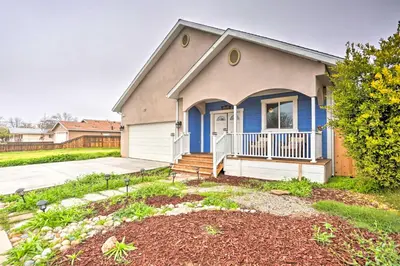 a house with a porch and a driveway at Stunning Clovis Home about 1 Mile to Old Town! in Clovis