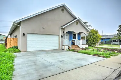 a house with a garage and a driveway at Stunning Clovis Home about 1 Mile to Old Town! in Clovis