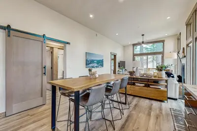 a kitchen with a large wooden table and chairs at Bear's Den in Truckee