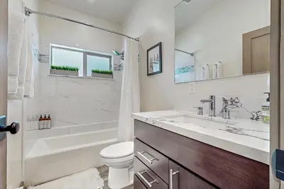 a bathroom with a tub and a toilet and a sink at Bear's Den in Truckee