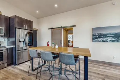a kitchen with a wooden table and chairs at Bear's Den in Truckee