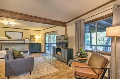 a living room with a bunk bed and a couch at Near Trails Cabin with 2-Level Deck in Twain Harte in Twain Harte