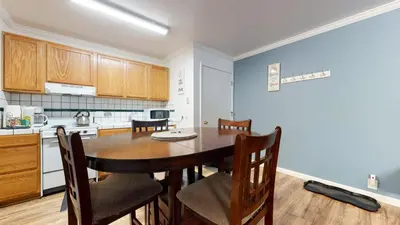a kitchen with a table and chairs in a room at Krystal Villas East #312 condo in Mammoth Lakes