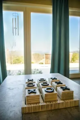 a table topped with boxes on top of a table with windows at Sierra Ranch - A Yosemite Retreat in Mariposa