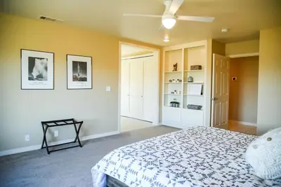a bedroom with a bed and a ceiling fan at Sierra Ranch - A Yosemite Retreat in Mariposa