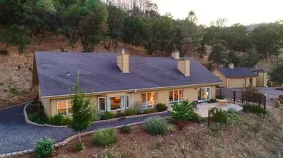 an aerial view of a house with a roof at Sierra Ranch - A Yosemite Retreat in Mariposa
