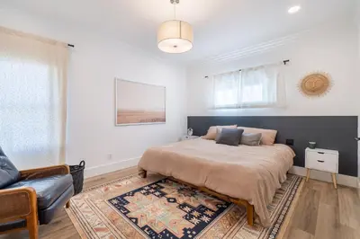 a bedroom with a bed and a couch at Plush 2-bed apt in Riverside Heights! in Reno