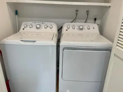 two white ovens in a kitchen next to a refrigerator at Beautiful 3 bedroom home located near Yosemite in Oakhurst