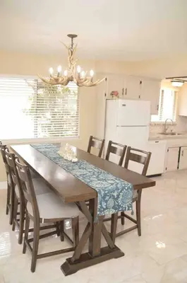 a dining room table and chairs in a kitchen at Beautiful 3 bedroom home located near Yosemite in Oakhurst