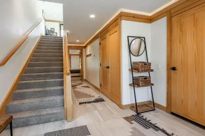 a staircase in a house with a hallway at Obsidian 300 in Mammoth Lakes