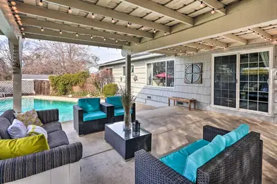 a patio with furniture and a swimming pool at 1 Mi to Main Street Sutter Creek Poolside Oasis! in Sutter Creek
