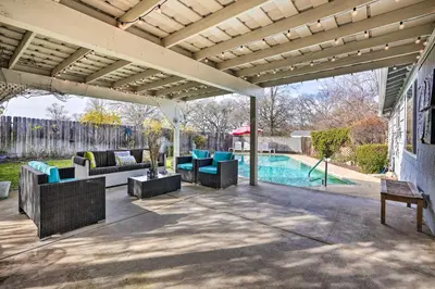 an outdoor patio with furniture and a swimming pool at 1 Mi to Main Street Sutter Creek Poolside Oasis! in Sutter Creek