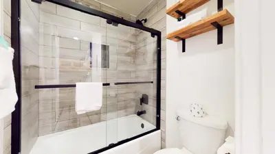 a bathroom with a shower and a toilet at Snowcreek I #11 condo in Mammoth Lakes