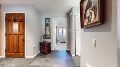 a hallway with a door leading to a living room at Snowcreek I #28 condo in Mammoth Lakes