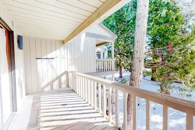 a porch of a house with a tree on it at Kingswood Village 2 in Kings Beach