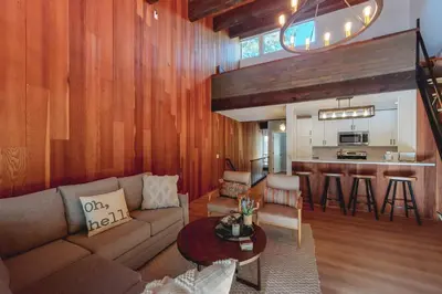 a living room with a couch and a kitchen at Kingswood Village 2 in Kings Beach