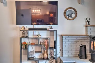 a kitchen with a shelf with flowers in it at Epic Mammoth Lakes Getaway with Shared Pool, Hot Tub in Mammoth Lakes