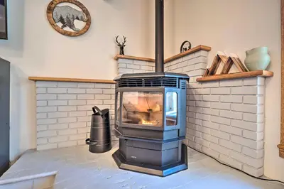 a stove in a room with a brick wall at Epic Mammoth Lakes Getaway with Shared Pool, Hot Tub in Mammoth Lakes