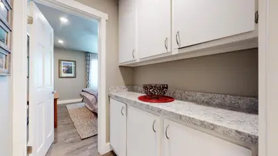 a kitchen with white cabinets and a red bowl on a counter at Mammoth Creek #9 condo in Mammoth Lakes
