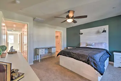 a bedroom with a bed and a ceiling fan at 4 Mi to City Center Family-Friendly Retreat! in Merced