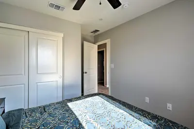 a bedroom with a bed and a ceiling at 4 Mi to City Center Family-Friendly Retreat! in Merced