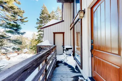 a porch of a house with snow on the ground at Back Country Basecamp in Stateline