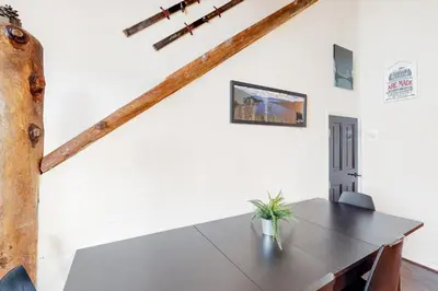 a dining room with a table with a plant on it at Back Country Basecamp in Stateline