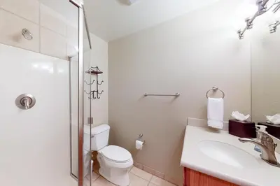a bathroom with a toilet and a sink and a shower at Snow Porch in Truckee