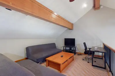 a living room with a couch and a table at Snow Porch in Truckee