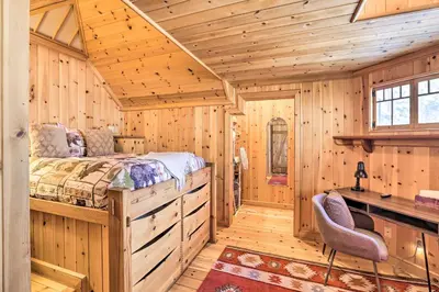 a bedroom with a bed in a wooden room at Less Than 1 Mi to Heavenly Lifts Tahoe Area Townhome! in Stateline