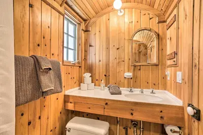 a wooden bathroom with a sink and a toilet at Less Than 1 Mi to Heavenly Lifts Tahoe Area Townhome! in Stateline