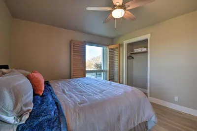 a bedroom with a bed and a ceiling fan at Picturesque Farmhouse on Working Almond Ranch in Oakdale
