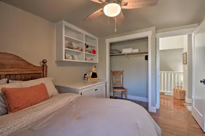 a bedroom with a bed and a ceiling fan at Picturesque Farmhouse on Working Almond Ranch in Oakdale