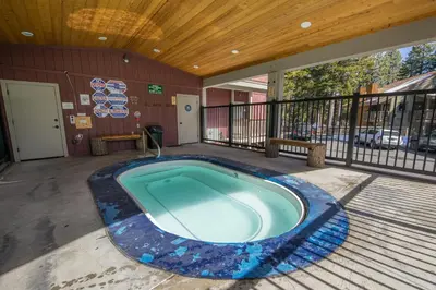 a swimming pool in the middle of a patio at Hidden Valley Village #103 nicely updated 1 bedroom 1 bathroom condo short 10 min walk from Village in Mammoth Lakes