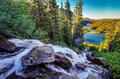 an aerial view of a river in a forest at Snowcreek 27 in Mammoth Lakes