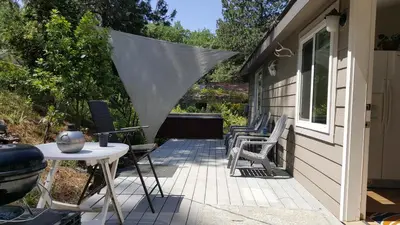 a patio with chairs and a table and a grill at Explore Amador and Calaveras County. in West Point