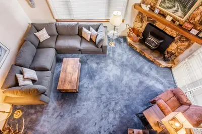an overhead view of a living room with a couch and a table at Spacious Winterset 26 2 Bedrm Plus Loft 3 Full Bathrm Townhome Sleeps 8 Steps to Free Town Shuttle in Mammoth Lakes