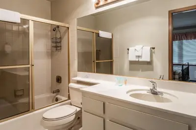 a bathroom with a sink and a toilet and a shower at Spacious Winterset 26 2 Bedrm Plus Loft 3 Full Bathrm Townhome Sleeps 8 Steps to Free Town Shuttle in Mammoth Lakes
