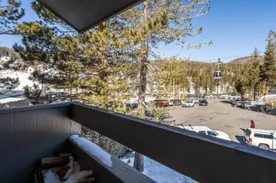 a balcony with a view of a parking lot at Ski in Ski Out 3 Bedrm 3 Bathrm fully remodeled Sierra Megeve Condo Steps to Canyon Lodge Sleeps 8 in Mammoth Lakes