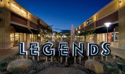 a building with a sign that reads le gems at Chic Apt w Jacuzzi, Pool, BBQ, & Mountain Views in Sparks