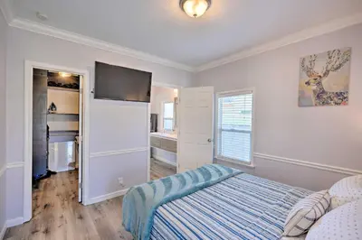 a bedroom with a bed and a flat screen tv at Pet-Friendly Sacramento Home about 5 to Downtown! in Sacramento