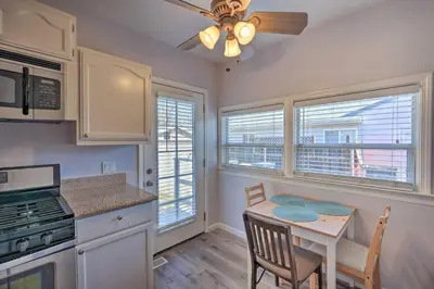 a kitchen with a table and a ceiling fan at Pet-Friendly Sacramento Home about 5 to Downtown! in Sacramento