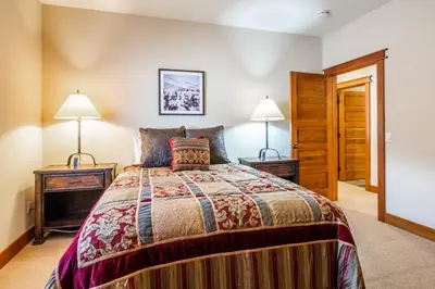 a bedroom with a bed and two night stands at Newly Updated Red Slate 4 is a 4 Bedrm 3 full Bathrm Townhome Close to Canyon Lodge That Sleeps 10 in Mammoth Lakes
