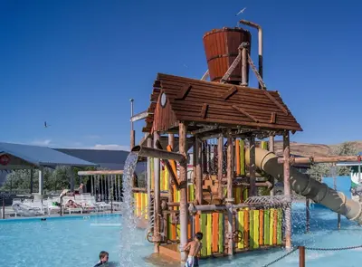 a water park with a water slide in a pool at Chic Apt with Jacuzzi, Pool Nr Casino & Shopping in Sparks