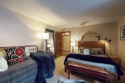 a bedroom with a bed and a bench in it at The Chalet in Zephyr Cove