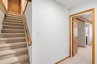 a staircase in a home with white walls at Overlooking Beautiful Bear Lake VH#318 in Bear Valley