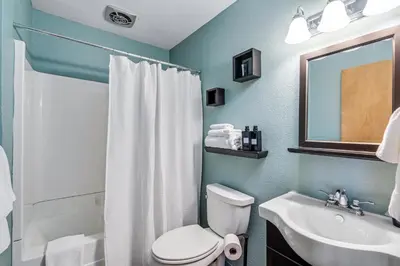 a bathroom with a white toilet and a sink at Overlooking Beautiful Bear Lake VH#318 in Bear Valley